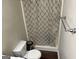 Cozy bathroom with a shower featuring a patterned curtain at 8113 Fieldstream Way, Douglasville, GA 30134