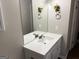 Bright bathroom featuring a large mirror and a vanity sink with ample counter space at 8113 Fieldstream Way, Douglasville, GA 30134