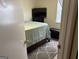 Well-lit bedroom featuring a bed, TV, and comfortable seating at 8113 Fieldstream Way, Douglasville, GA 30134