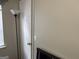 Neutral hallway area featuring a white door and a lamp at 8113 Fieldstream Way, Douglasville, GA 30134