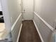 Hallway view showcasing a clean white door, gray walls and paneled molding at 8113 Fieldstream Way, Douglasville, GA 30134