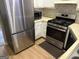 Well-equipped kitchen with stainless steel appliances and functional layout at 8113 Fieldstream Way, Douglasville, GA 30134