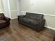 Living room showcasing a gray suede sofa with a side table, ideal for modern living at 8113 Fieldstream Way, Douglasville, GA 30134