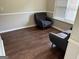 Cozy living room with wood floors and neutral decor, offering a relaxing atmosphere at 8113 Fieldstream Way, Douglasville, GA 30134