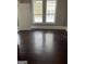 Bedroom with two bright windows and hardwood floors at 3155 E Point St, East Point, GA 30344