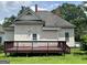 Exterior featuring a deck, yard, and siding at 3155 E Point St, East Point, GA 30344