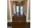 Hallway featuring wood floors, neutral walls, and doorways leading to other rooms at 3155 E Point St, East Point, GA 30344