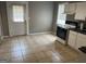 Kitchen featuring a range, sink, and door to the backyard at 3155 E Point St, East Point, GA 30344