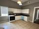 Bright kitchen features modern appliances and ample cabinet space at 3155 E Point St, East Point, GA 30344