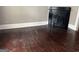 Living room featuring hardwood floors and non-functional fireplace at 3155 E Point St, East Point, GA 30344