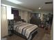 Cozy bedroom features modern decor, a large bed, and ample storage with a spacious closet at 439 River Rd, Jonesboro, GA 30236