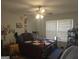 Bedroom features a ceiling fan, one window, and a patterned brown and beige quilt at 439 River Rd, Jonesboro, GA 30236