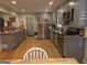 Updated kitchen with stainless steel appliances and stylish cabinets, seamlessly blending form and function at 439 River Rd, Jonesboro, GA 30236