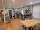 Open kitchen with grey cabinets, stainless appliances, breakfast nook and wooden floors at 439 River Rd, Jonesboro, GA 30236