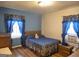 Comfortable bedroom with hardwood floors, cozy decor, and bright windows, creating a relaxing atmosphere at 1712 Clifton Se Way, Atlanta, GA 30316