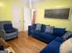 Inviting living room with hardwood floors, a comfortable blue sofa, and bright, cheerful accents at 1712 Clifton Se Way, Atlanta, GA 30316