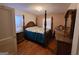 Spacious bedroom featuring a four-poster bed, hardwood floors, and ample natural light at 1712 Clifton Se Way, Atlanta, GA 30316