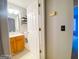 A clean bathroom featuring a vanity, toilet, and shower with a white curtain at 5553 Strathmoor Manor Cir, Lithonia, GA 30058