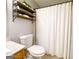 Bathroom featuring a vanity, toilet, and shower with a white curtain at 5553 Strathmoor Manor Cir, Lithonia, GA 30058