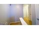 Hallway with light-colored walls and trim, showcasing the entrance to several rooms at 5553 Strathmoor Manor Cir, Lithonia, GA 30058