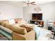 Cozy living room with a large sectional sofa, a modern coffee table, and a wall-mounted TV at 5553 Strathmoor Manor Cir, Lithonia, GA 30058