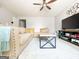 Comfortable living room space with large sectional sofa, modern coffee table, and entertainment center at 5553 Strathmoor Manor Cir, Lithonia, GA 30058