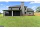 Exterior view of home with a screened in porch and large backyard at 935 S Laney Rd, Locust Grove, GA 30248