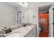 Bathroom with granite counters, double sinks and a walk-in shower at 935 S Laney Rd, Locust Grove, GA 30248