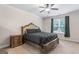 Relaxing main bedroom with a ceiling fan and a large window at 935 S Laney Rd, Locust Grove, GA 30248