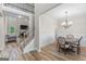 Open-concept view of the dining room, stairs, and living room with a fireplace at 935 S Laney Rd, Locust Grove, GA 30248
