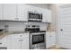 Well-equipped kitchen with stainless appliances and granite countertops at 935 S Laney Rd, Locust Grove, GA 30248