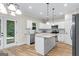 Sun-filled kitchen features granite counters, an island and access to the patio at 935 S Laney Rd, Locust Grove, GA 30248