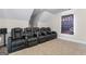 Entertainment room featuring tiered seating and a large viewing screen at 935 S Laney Rd, Locust Grove, GA 30248