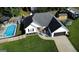 Well-maintained property with a large manicured lawn, swimming pool, and inviting front porch at 401 N Lost Lake Cv, Villa Rica, GA 30180