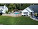 Property featuring a pool, play set, inviting front porch and two car garage, perfect for Gathering living at 401 N Lost Lake Cv, Villa Rica, GA 30180