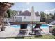 An inviting backyard pool with a slide and lounge chairs, ideal for Gathering fun and relaxation at 401 N Lost Lake Cv, Villa Rica, GA 30180