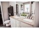 Bathroom highlighting double sinks with granite counters and modern black faucets at 401 N Lost Lake Cv, Villa Rica, GA 30180