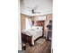Bedroom with a large bed, dark furniture and a window letting in natural light at 401 N Lost Lake Cv, Villa Rica, GA 30180