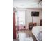 Bright bedroom featuring a ceiling fan and a desk area by the window at 401 N Lost Lake Cv, Villa Rica, GA 30180