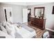 Well-lit bedroom with a view into the living room and bathroom, featuring stylish decor at 401 N Lost Lake Cv, Villa Rica, GA 30180