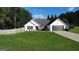 Home featuring a two-car garage, manicured lawn, and front patio perfect for entertaining guests at 401 N Lost Lake Cv, Villa Rica, GA 30180