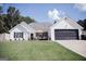 Charming single-Gathering home featuring a well-maintained lawn, inviting front porch and two car garage at 401 N Lost Lake Cv, Villa Rica, GA 30180