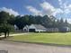 Well-maintained property with two car garage, large manicured lawn and off street parking at 401 N Lost Lake Cv, Villa Rica, GA 30180