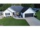 Single-Gathering home featuring a two car garage, and an inviting front porch perfect for entertaining at 401 N Lost Lake Cv, Villa Rica, GA 30180