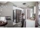 Kitchen featuring stainless steel refrigerator, white cabinets, and an eat-in dining area at 401 N Lost Lake Cv, Villa Rica, GA 30180
