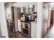 Modern kitchen with stainless steel appliances, white cabinets, and a functional layout at 401 N Lost Lake Cv, Villa Rica, GA 30180