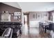 Open-concept living room and dining room with wood flooring and plenty of natural light at 401 N Lost Lake Cv, Villa Rica, GA 30180