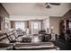 Living room featuring leather furniture, neutral walls, and wood flooring at 401 N Lost Lake Cv, Villa Rica, GA 30180