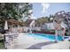 Outdoor pool with a slide and lounge area offers a perfect space for recreation and enjoyment at 401 N Lost Lake Cv, Villa Rica, GA 30180