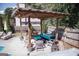 Comfortable outdoor seating area under a stylish pergola, perfect for relaxation and entertaining guests at 401 N Lost Lake Cv, Villa Rica, GA 30180